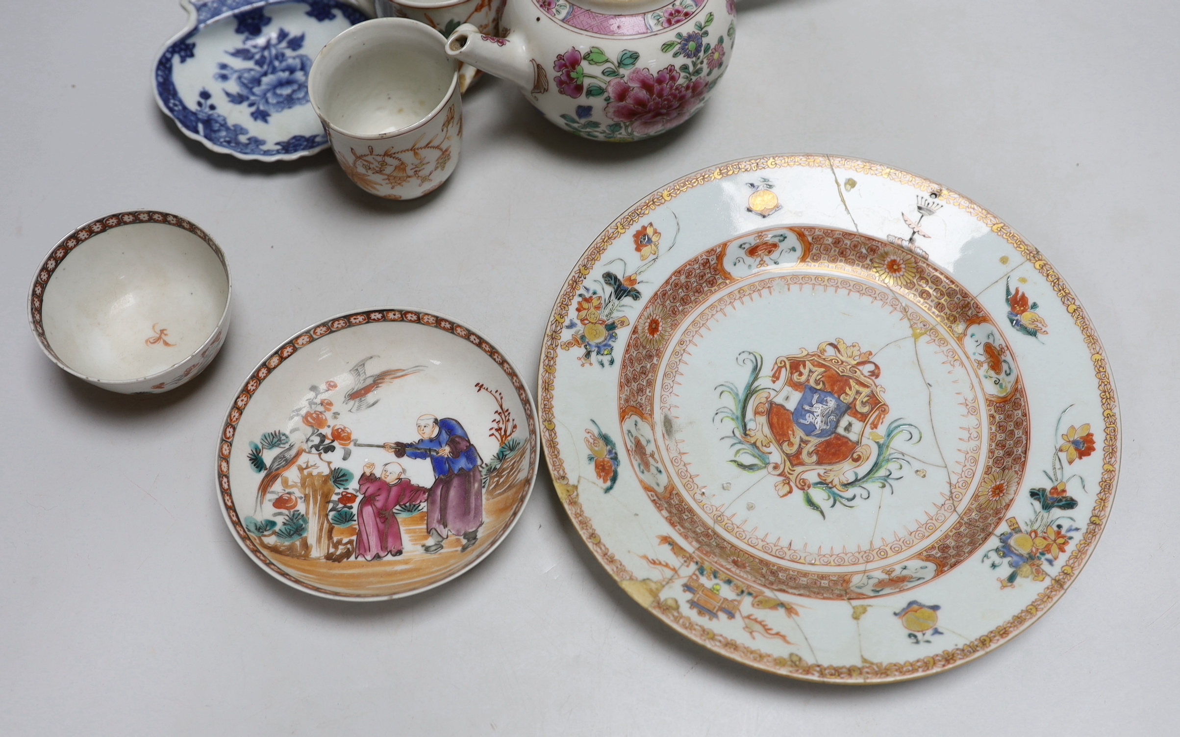 Collection of 18th century Chinese porcelain including an armorial dish, teapot hand painted in the famille rose palette and pair of cups hand painted with flowers, the largest 28cm high